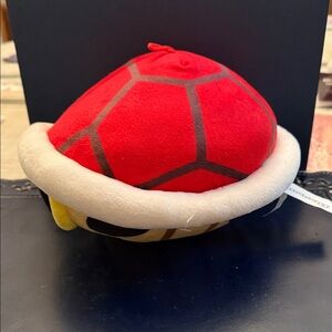 Mario Kart Red Shell plush toy. 
This